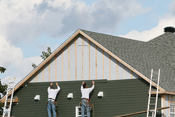 Professional Storm Damage Siding Repair technician working in Victoria, TX